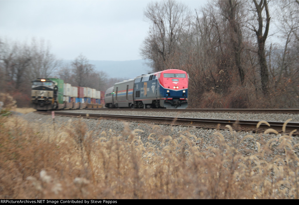 Amtrak 108 heads east at MP 116 while NS 9440 sits on the siding